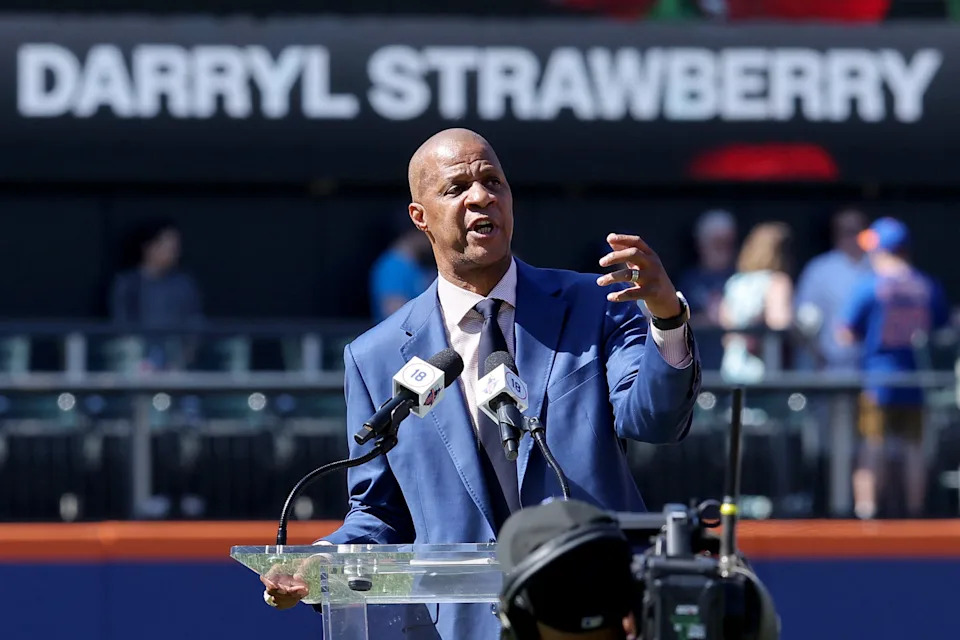 New York Mets former player Darryl Strawberry speaks during a pregame ceremony to retire his number 18 before a game against the Arizona Diamondbacks at Citi Field. Mandatory Credit: