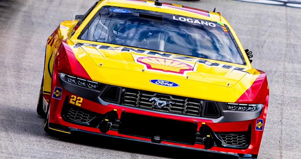 Joey Logano signals from his No. 22 Ford during practice at Bristol Motor Speedway