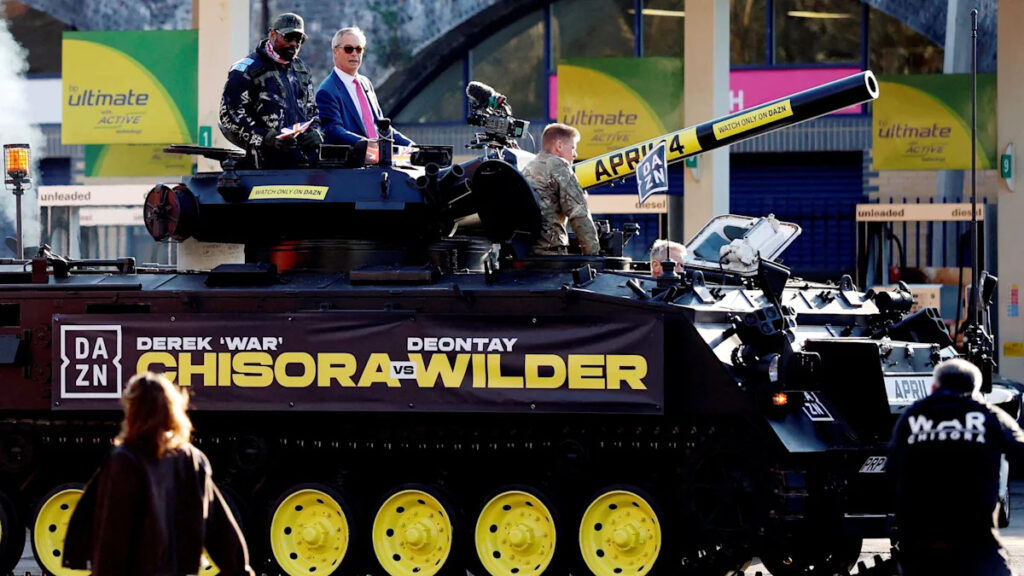 Chisora arrives to Wilder event in tank with Farage