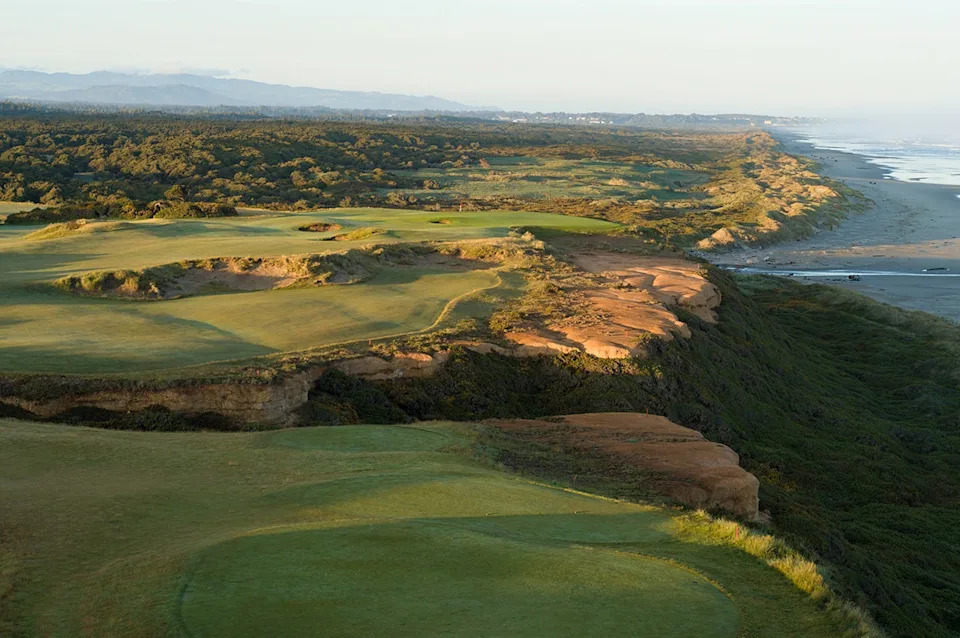 The short, par-4 16th at Bandon Dunes plays tight to the cliffs above the ocean at Bandon Dunes Golf Resort in Oregon.