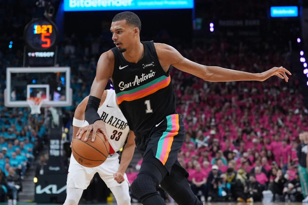 Wembanyama revels in safety of Hall of Famers, fans in playoff debut as Spurs top Blazers