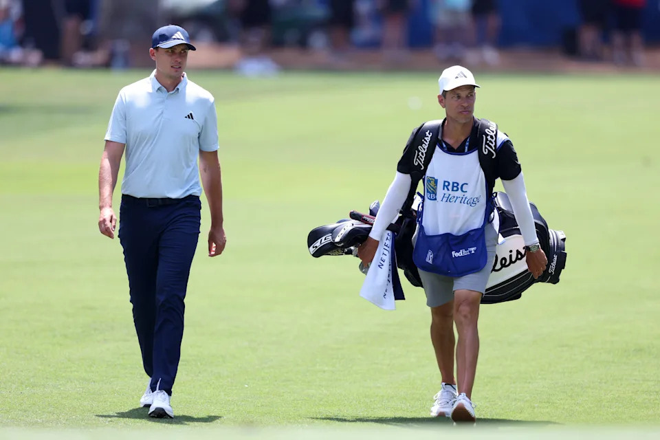 Ludvig Aberg of Sweden walks the 15th hole alongside caddie Joe Skovron during the first round of the RBC Heritage 2026 at Harbour Town Golf Links on April 16, 2026 in Hilton Head Island, South Carolina.