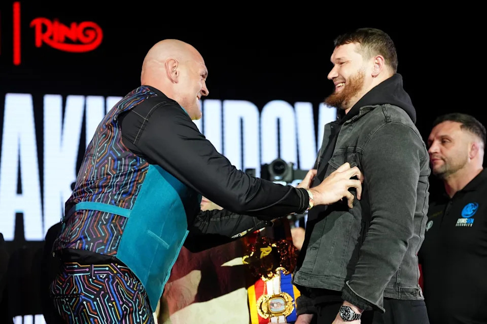 Tyson Fury with opponent Arslanbek Makhmudov in February (PA Wire)