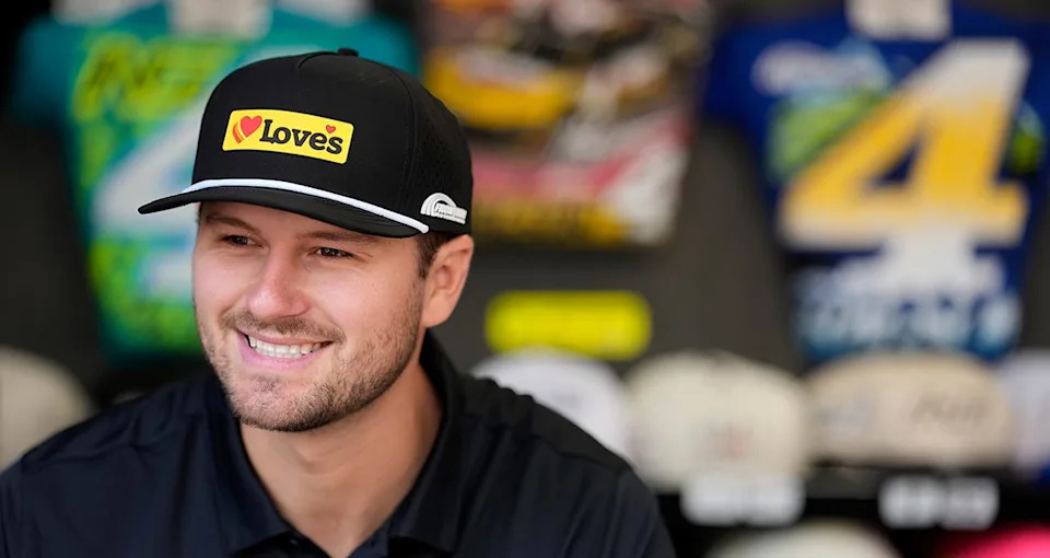 Todd Gilliland signs autographs for NASCAR fans before the NASCAR Cup Series race at Daytona International Speedway on February 14, 2026 in Daytona Beach, Florida.
