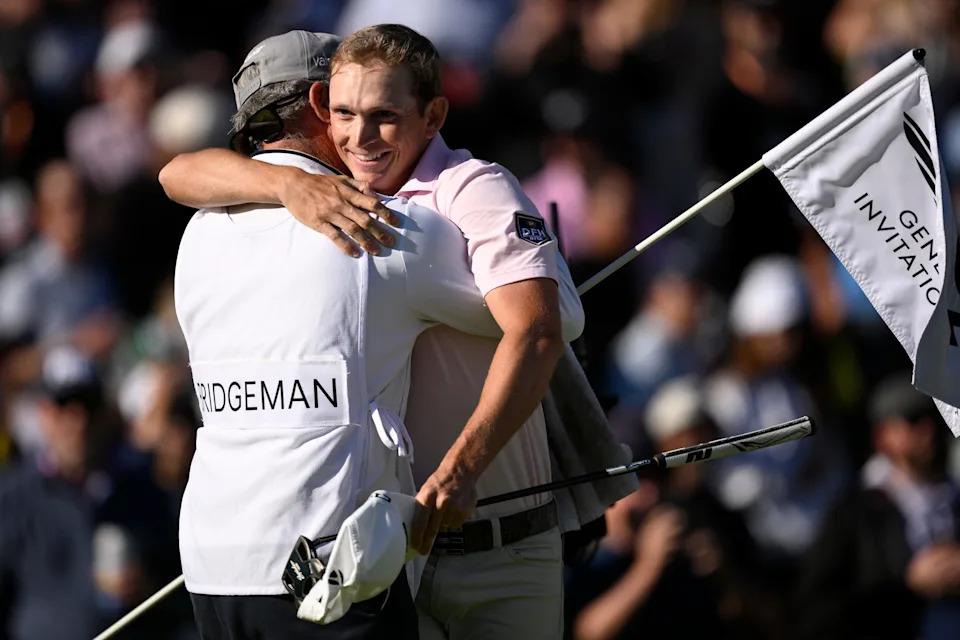 Jacob Bridgeman of the United States reacts to his winning putt on the 18th green with his caddie G.W. Cable during the final round of The Genesis Invitational 2026 at Riviera Country Club on February 22, 2026 in Pacific Palisades, California.