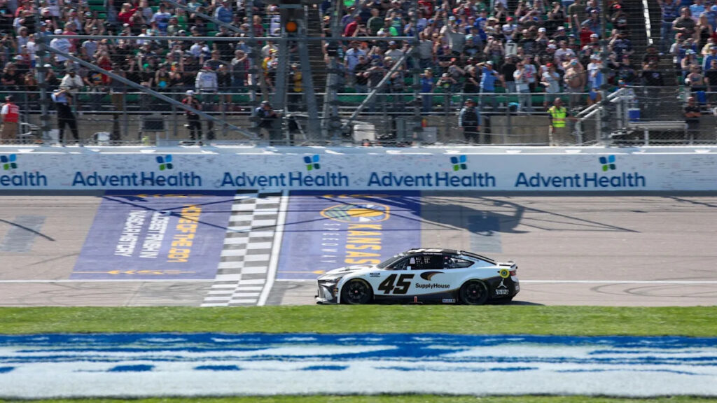 Tyler Reddick passes Kyle Larson on the final lap of OT to win NASCAR Cup Series race at Kansas