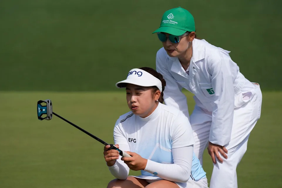 Arianna Lau lines up her putt on the second green during the final round of the Augusta National Women's Amateur golf tournament at Augusta National Golf Club.