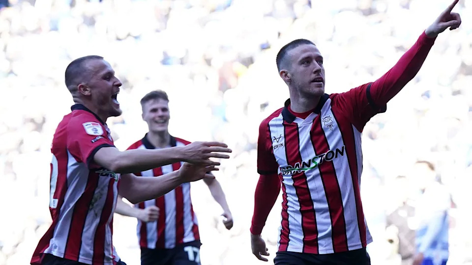 Jack Moylan (right) celebrates scoring for Lincoln in their promotion-clinching game against Reading