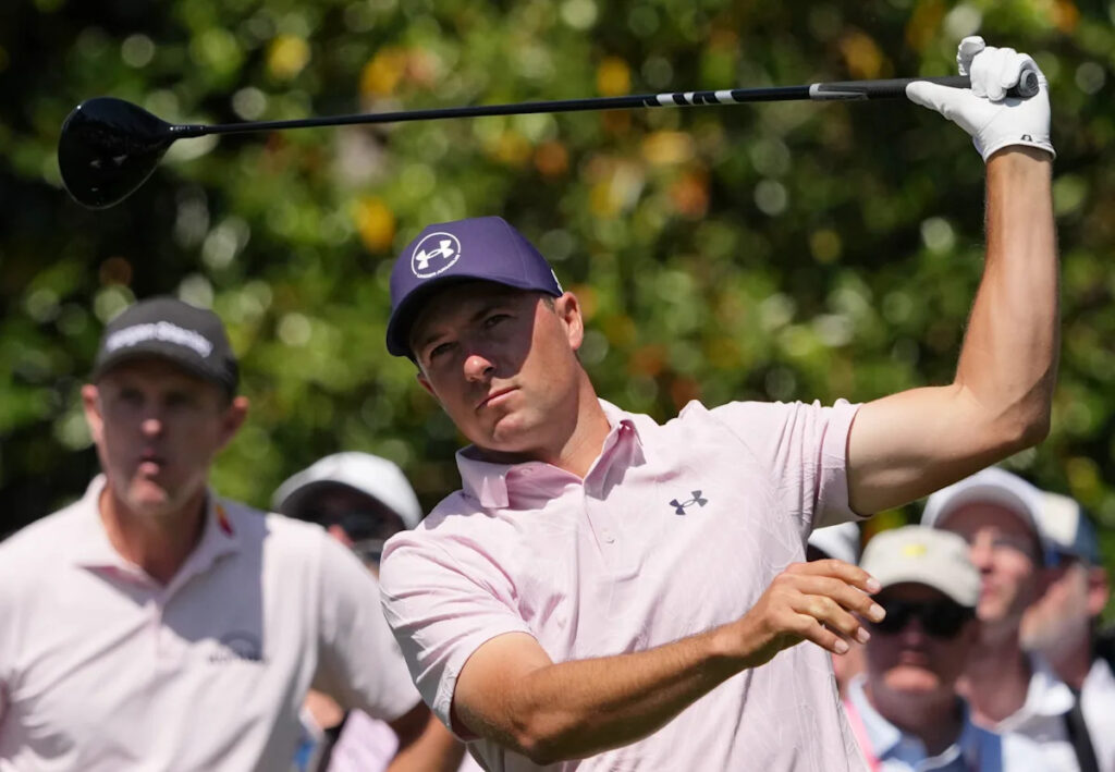 Jordan Spieth hits patron with tee shot, then gives him a signed glove