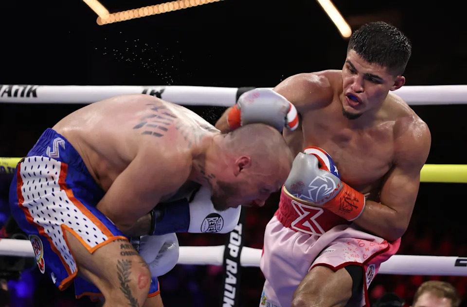 NEW YORK, NEW YORK - FEBRUARY 14:  Xander Zayas punches Slawa Spomer during their junior middleweight fight during their junior bantamweight fight during their lightweight fight during their welterweight fight, during their heavyweight fight at The Theater at Madison Square Garden on February 14, 2025 in New York City. (Photo by Al Bello/Getty Images)