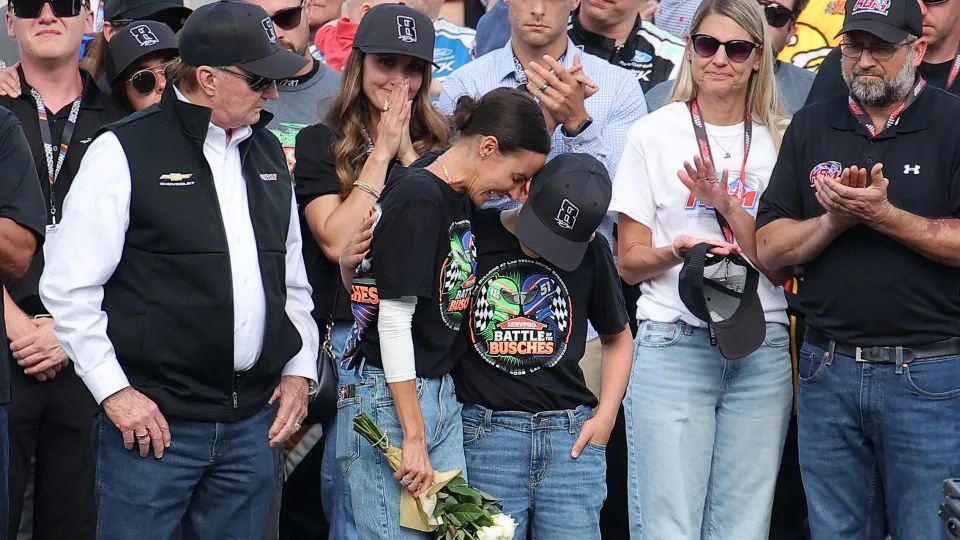 Samantha Busch and Brexton Busch embrace one another on the grid during the remembrance ceremony for Kyle Busch. - Jonathan Bachman/Getty Images