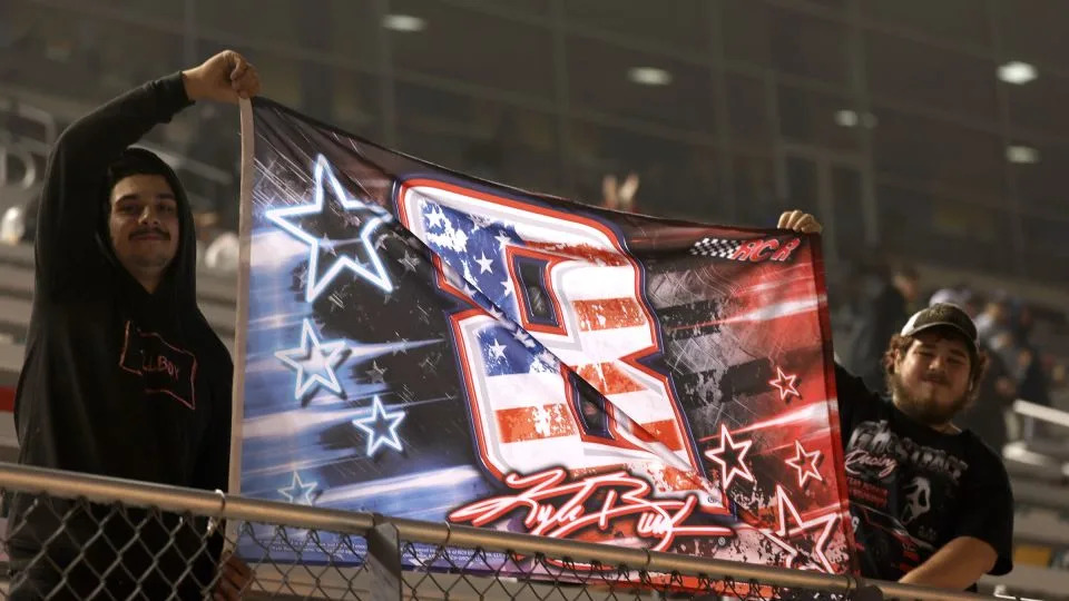 NASCAR fans display a "8 Kyle Busch" flag during the NASCAR O'Reilly Auto Parts Series Charbroil 300 at Charlotte Motor Speedway on May Saturday in Concord, North Carolina. - David Jensen/Getty Images