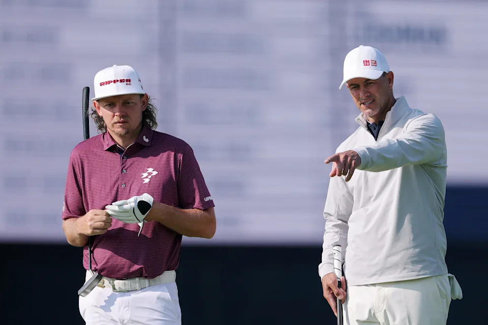 Cameron Smith and Adam Scott talk on the 12th green during a practice round prior to the 125th U.S. Open at Oakmont Country Club.