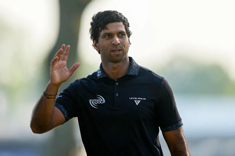 Aaron Rai, of England, waves on the 18th green after his round (AP)