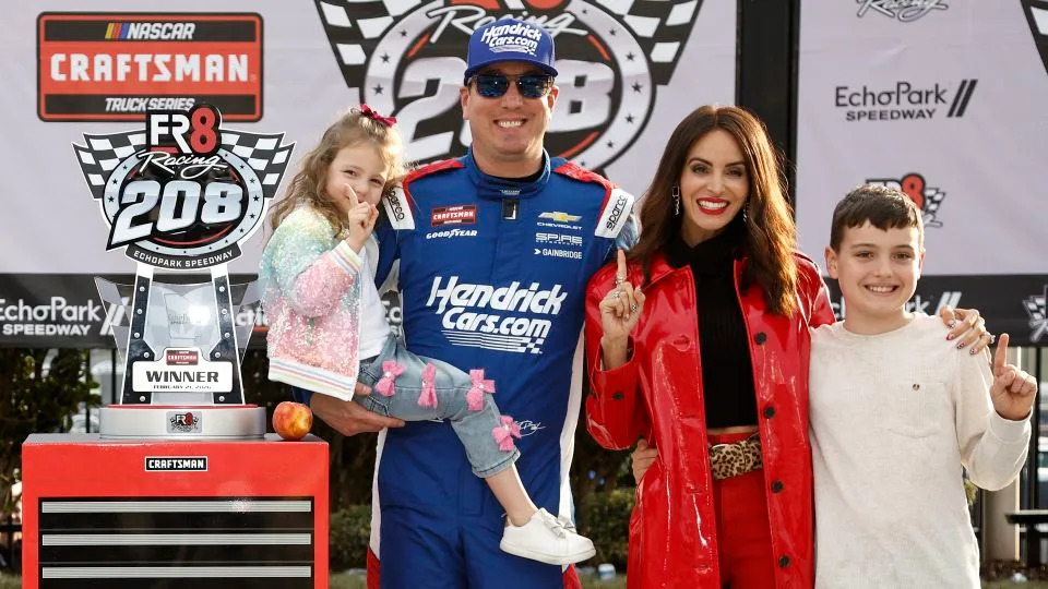 Kyle Busch celebrates with his wife, Samantha, and their children, Lennix and Brexton, after winning a Truck Series race in Hampton, Georgia, in February. - Sean Gardner/Getty Images