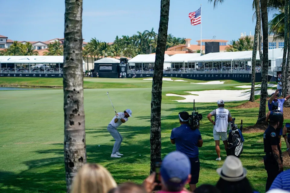 Cameron Young plays his approach shot to the 18th hole during the first round of the Cadillac Championship golf tournament.