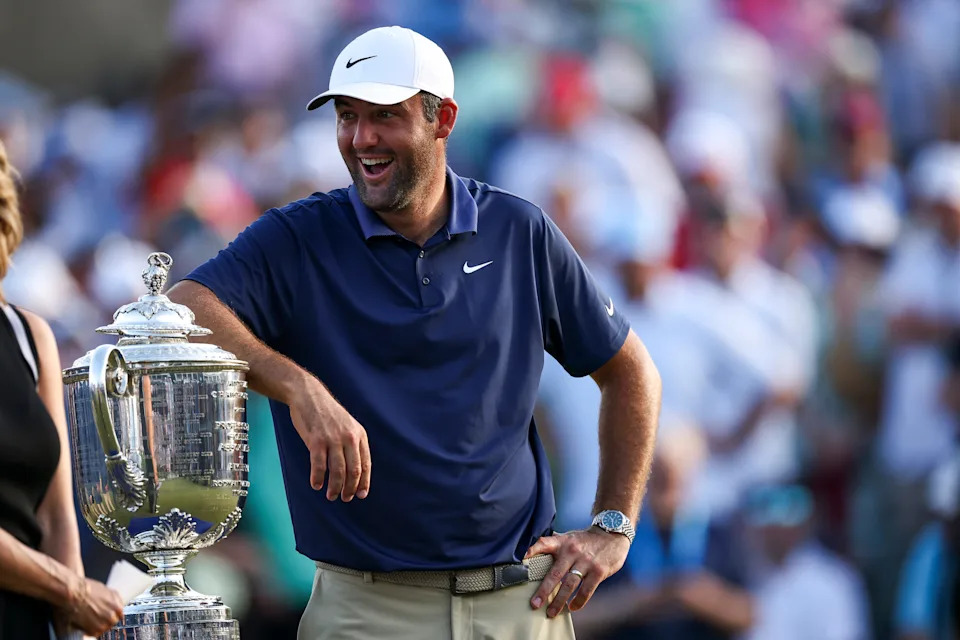 Scottie Scheffler poses with the Wanamaker Trophy after winning the 2025 PGA Championship at Quail Hollow Club.