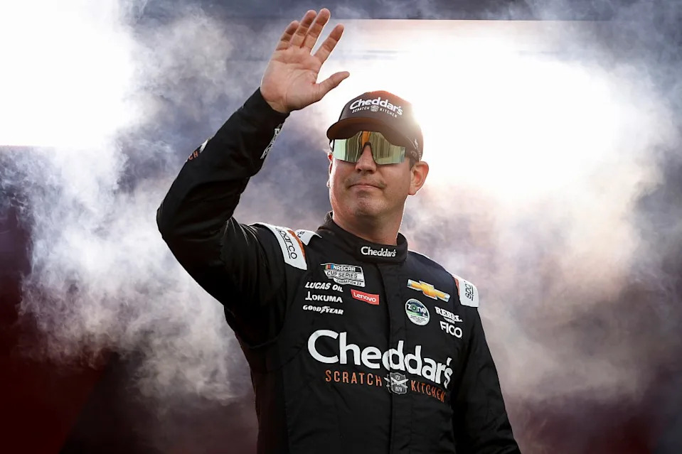 Kyle Busch, driver of the Cheddar’s Scratch Kitchen Chevrolet, waves to fans as he walks onstage during driver intros prior to the NASCAR Cup Series Coke Zero Sugar 400 at Daytona International Speedway on August 24, 2024 in Daytona Beach, Florida. Getty Images