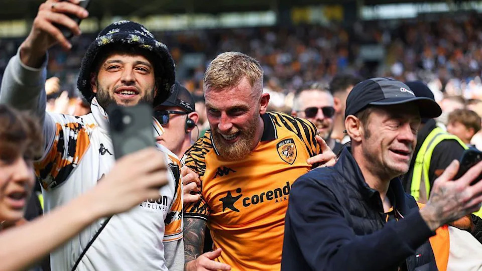 Hull City fans celebrate reaching the play-offs with match-winner Ollie McBurnie
