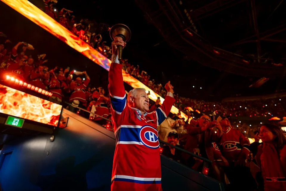 Claude Lemieux carries the torch in the opening ceremony of Game Three of the Eastern Conference Final of the 2026 Stanley Cup Playoffs between the Montreal Canadiens and the Carolina Hurricanes at the Bell Centre. NHLI via Getty Images
