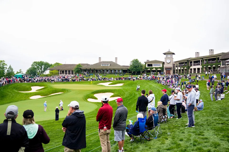 Spectators stand around the 18th green during the 2025 Workday Golden Bear Pro-Am at Muirfield Village Golf Club.