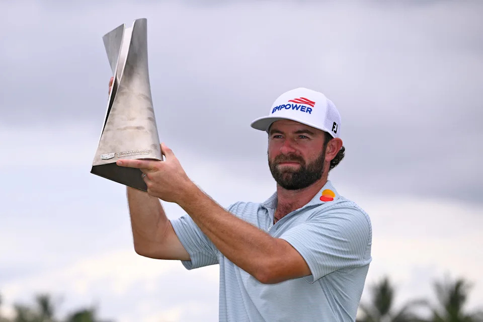 Cameron Young of the United States lifts the trophy after winning the final round of the Cadillac Championship 2026 at Trump National Doral Miami on May 03, 2026 in Doral, Florida.