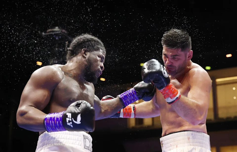 Filip Hrgovic (right) sustained damage against David Adeleye but triumphed on points (Getty)