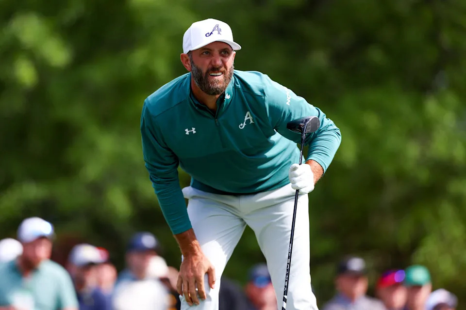 Dustin Johnson watches his shot from the fifth tee during the first round of the Masters Tournament at Augusta National Golf Club.