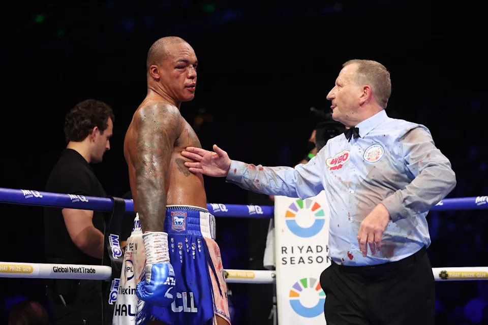 A ringside doctor (left) and referee Howard Foster checked on Wardley before rounds nine and 10 (Getty)