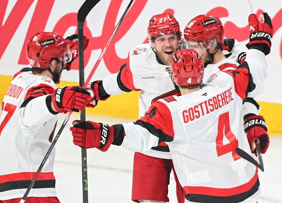 Sebastian Aho (right) celebrates his goal with Carolina teammates <a class="link " href="https://sports.yahoo.com/nhl/players/7900/" data-i13n="sec:content-canvas;subsec:anchor_text;elm:context_link" data-ylk="slk:Andrei Svechnikov;sec:content-canvas;subsec:anchor_text;elm:context_link;itc:0" data-yga="{"yLinkElement":"context_link","yModuleName":"content-canvas","yLinkText":"Andrei Svechnikov","ySubModuleName":"anchor_text","yHasCommerce":false}">Andrei Svechnikov</a> (37), Nikolaj Ehlers (27) and Shayne Gostisbehere (4) during the first period of the Hurricanes’ Game 4 win over the Canadiens. The Canadian Press via AP