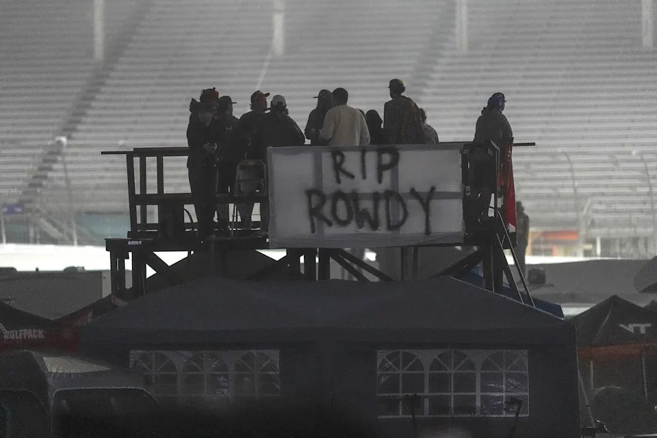 May 23, 2026; Concord, North Carolina, USA; Fans remember deceased driver Kyle Busch as they watch during the Charbroil 300 at Charlotte Motor Speedway. Mandatory Credit: Jim Dedmon-Imagn Images