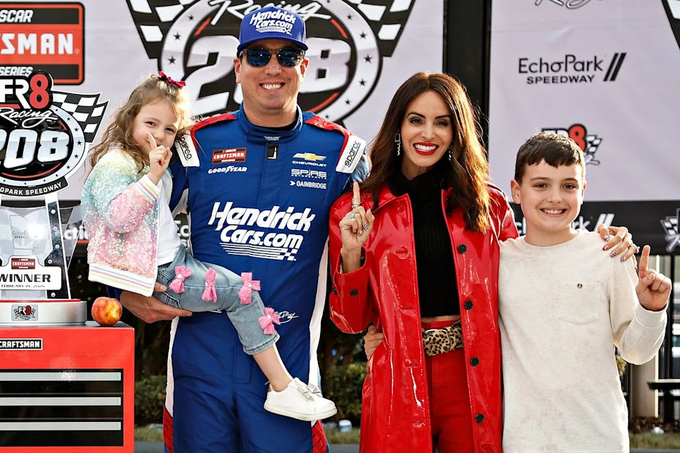 Kyle Busch with his wife Samantha and their kids, daughter Lennix and son Brexton, celebrate in the victory lane after winning on Feb. 21, 2026.Credit: Sean Gardner/Getty