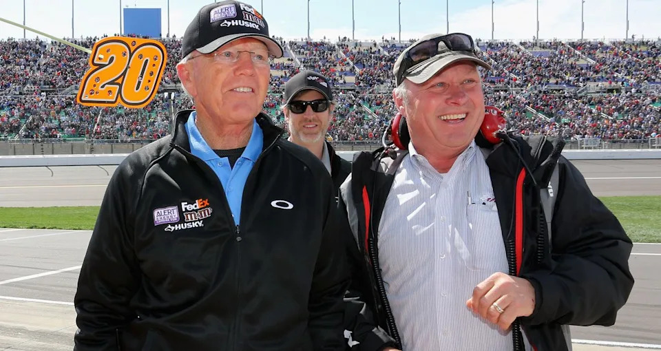 Joe Gibbs, left, and Jimmy Makar celebrate a win at Kansas in 2013.