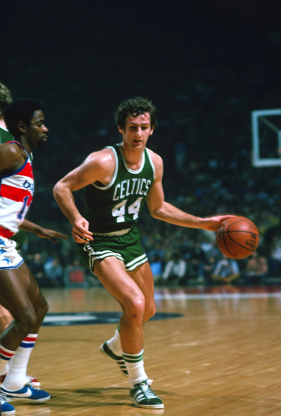 LANDOVER, MD – CIRCA 1975: Paul Westphal #44 of the Boston Celtics drives on Kevin Porter #10 of the Washington Bullets during an NBA basketball game circa 1975 at the Capital Centre in Landover, Maryland. Westphal played for the Celtics from 1972-75. (Photo by Focus on Sport/Getty Images) | Getty Images