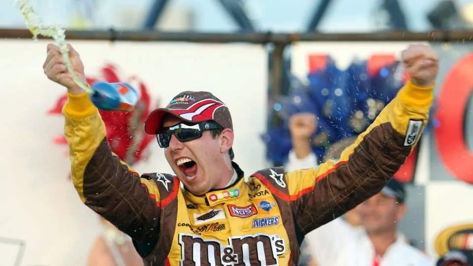 Kyle Busch celebrates in Victory Lane after a Cup Series win in Las Vegas in 2009. - Isaac Brekken/AP