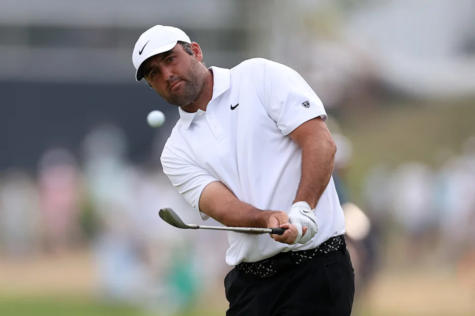 May 16, 2026; Newtown Square, Pennsylvania, USA; Scottie Scheffler hits on the 18th green during the third round of the PGA Championship golf tournament. Mandatory Credit: Bill Streicher-Imagn Images