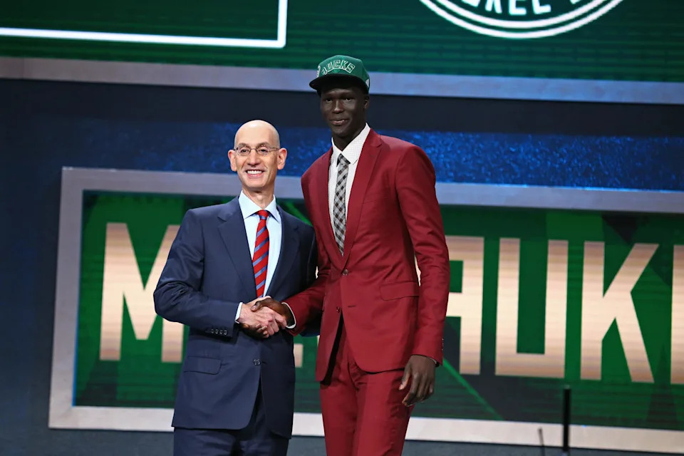 BROOKLYN, NY – JUNE 23: Thon Maker shakes hands with NBA Commissioner Adam Silver after being selected number ten overall by the Milwaukee Bucksduring the 2016 NBA Draft on June 23, 2015 at Barclays Center in Brooklyn, New York. NOTE TO USER: User expressly acknowledges and agrees that, by downloading and or using this photograph, User is consenting to the terms and conditions of the Getty Images License Agreement. Mandatory Copyright Notice: Copyright 2016 NBAE (Photo by Nathaniel S. Butler /NBAE via Getty Images) | NBAE via Getty Images