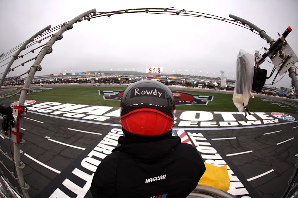 A NASCAR Official in the flagstand has "Rowdy" taped onto his helmet in tribute to the passing of Kyle Busch.