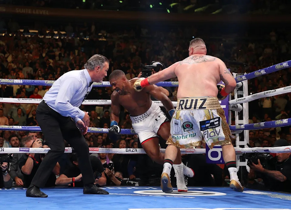 Anthony Joshua (centre) was stunned by Andy Ruiz Jr in 2019 before avenging the defeat (Getty)