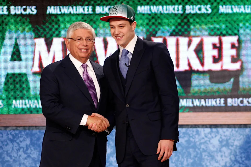 NEWARK, NJ – JUNE 23: Jimmer Fredette from BYU greets NBA Commissioner David Stern after he was selected #10 overall by the Milwaukee Bucks in the first round during the 2011 NBA Draft at the Prudential Center on June 23, 2011 in Newark, New Jersey. NOTE TO USER: User expressly acknowledges and agrees that, by downloading and/or using this Photograph, user is consenting to the terms and conditions of the Getty Images License Agreement. (Photo by Mike Stobe/Getty Images) | Getty Images