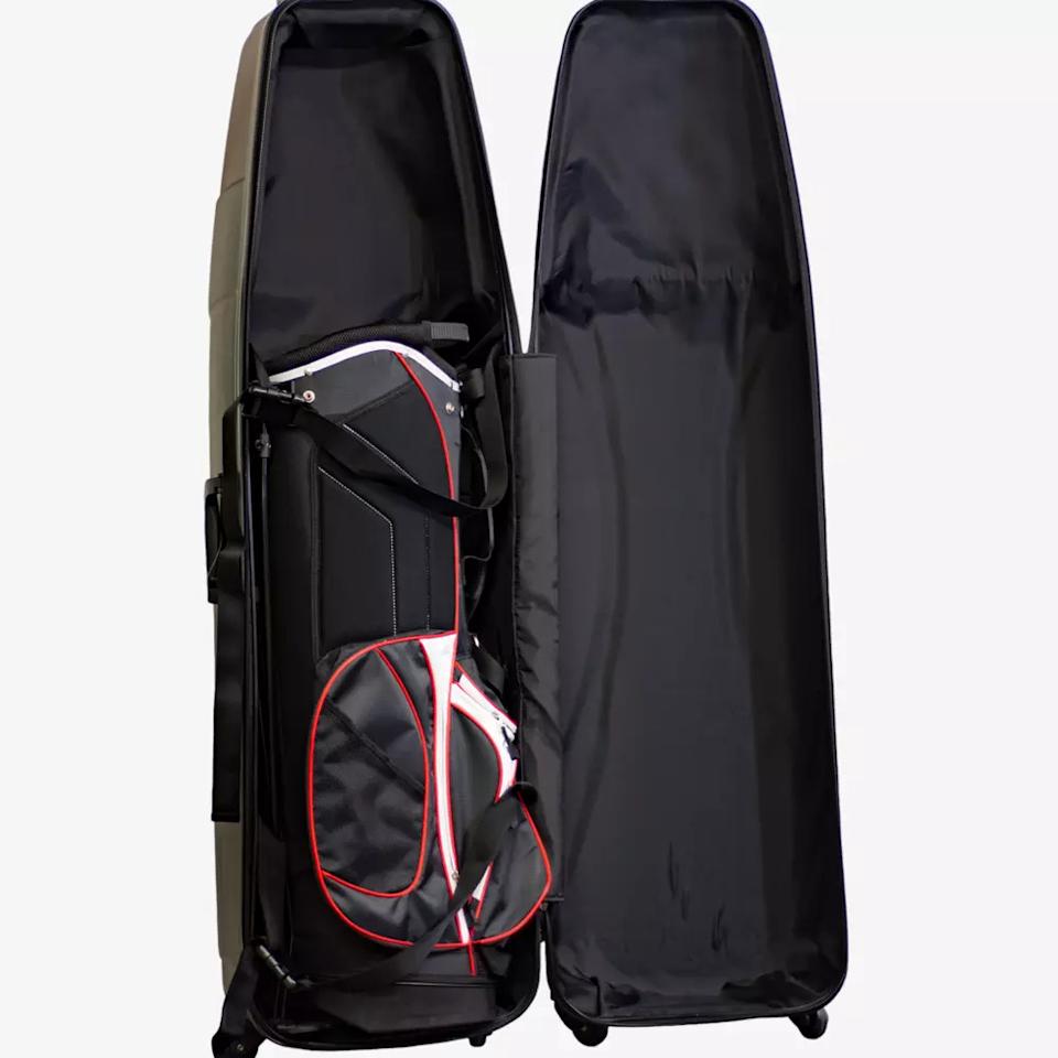 A black hard-shell travel case is open, revealing a black, white, and red golf bag packed inside—perfect for carrying clubs and the best golf rangefinders. The case stands upright with the lid propped open, showing its spacious interior.