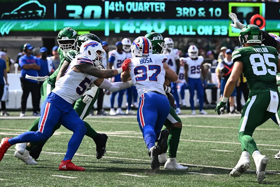 Bills defensive end Joey Bosa (97) hits <a class="link " href="https://sports.yahoo.com/nfl/teams/ny-jets/" data-i13n="sec:content-canvas;subsec:anchor_text;elm:context_link" data-ylk="slk:Jets;sec:content-canvas;subsec:anchor_text;elm:context_link;itc:0" data-yga="{"yLinkElement":"context_link","yModuleName":"content-canvas","yLinkText":"Jets","ySubModuleName":"anchor_text","yHasCommerce":false}">Jets</a> quarterback <a class="link " href="https://sports.yahoo.com/nfl/players/33399/" data-i13n="sec:content-canvas;subsec:anchor_text;elm:context_link" data-ylk="slk:Justin Fields;sec:content-canvas;subsec:anchor_text;elm:context_link;itc:0" data-yga="{"yLinkElement":"context_link","yModuleName":"content-canvas","yLinkText":"Justin Fields","ySubModuleName":"anchor_text","yHasCommerce":false}">Justin Fields</a> (7) causing him to fumble the ball Bill Kostroun/New York Post