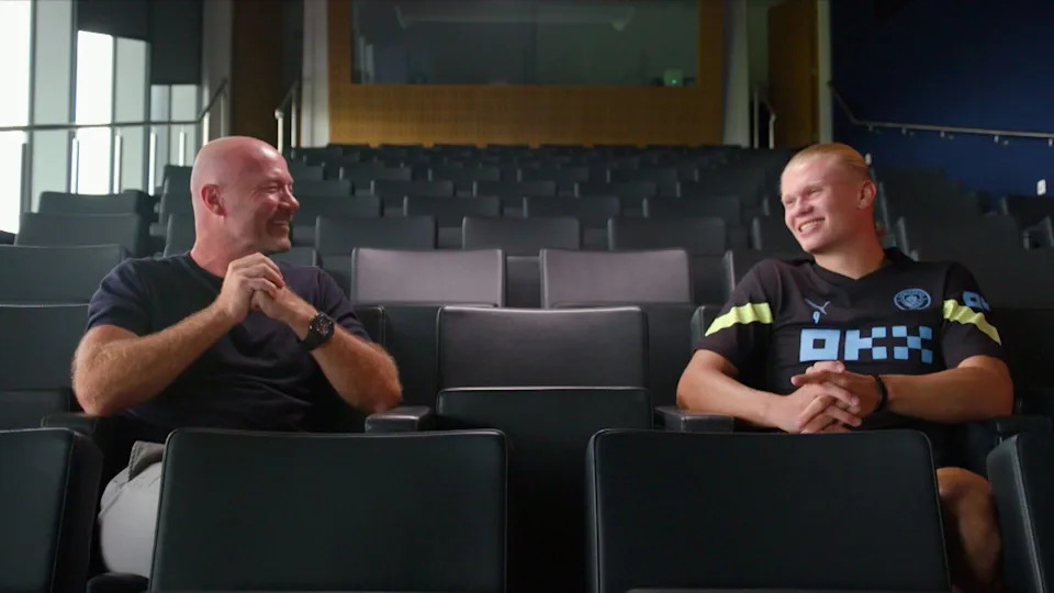 A picture of Alan Shearer talking to Erling Haaland