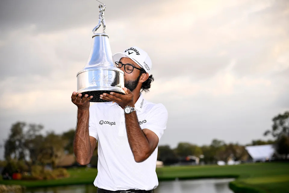 Akshay Bhatia of the United States kisses the trophy after winning the Arnold Palmer Invitational presented by Mastercard 2026 in a playoff at Arnold Palmer Bay Hill Golf Course on March 08, 2026 in Orlando, Florida.