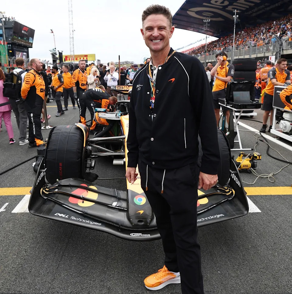 Golf superstar Justin Rose stands in front of the Oscar Piastri of Australia (81) McLaren MCL39 Mercedes ahead of the F1 Grand Prix of Netherlands at Circuit Zandvoort on August 31, 2025