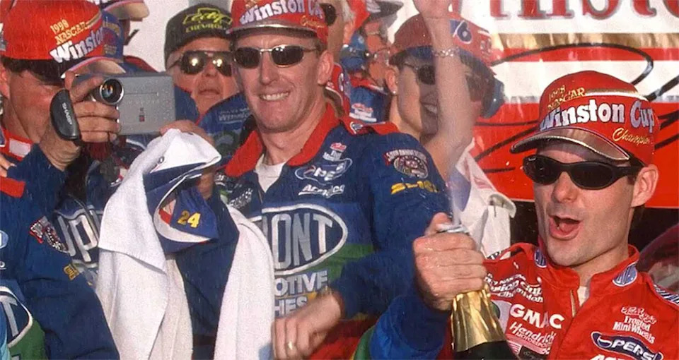 Mike Trower, center, celebrates with Jeff Gordon.