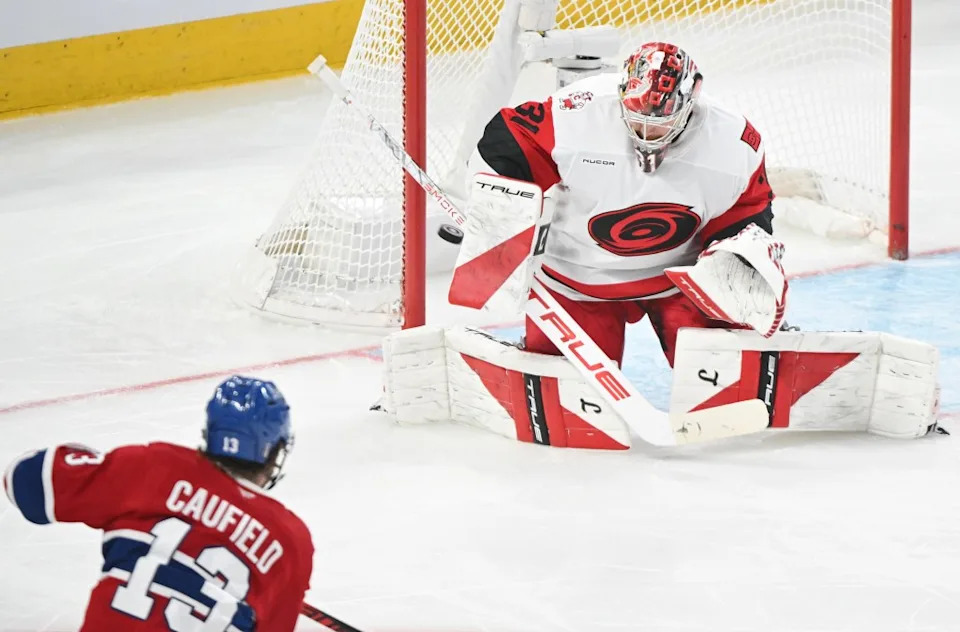 Frederik Andersen, who had 17 saves, stops a <a class="link " href="https://sports.yahoo.com/nhl/players/8293/" data-i13n="sec:content-canvas;subsec:anchor_text;elm:context_link" data-ylk="slk:Cole Caufield;sec:content-canvas;subsec:anchor_text;elm:context_link;itc:0" data-yga="{"yLinkElement":"context_link","yModuleName":"content-canvas","yLinkText":"Cole Caufield","ySubModuleName":"anchor_text","yHasCommerce":false}">Cole Caufield</a> shot during the Hurricanes’ Game 4 win over the Canadiens. The Canadian Press via AP