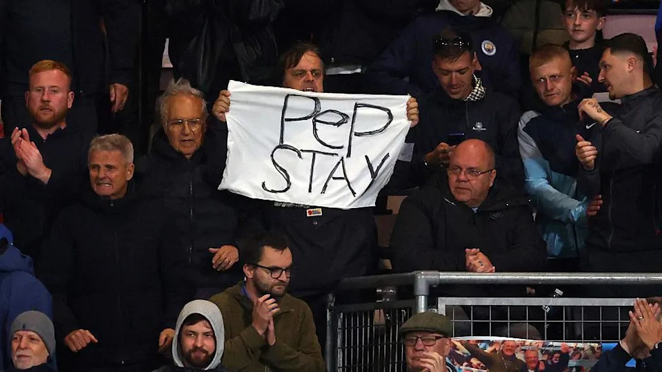 Pep Guardiola banner to stay at the club held up by fan