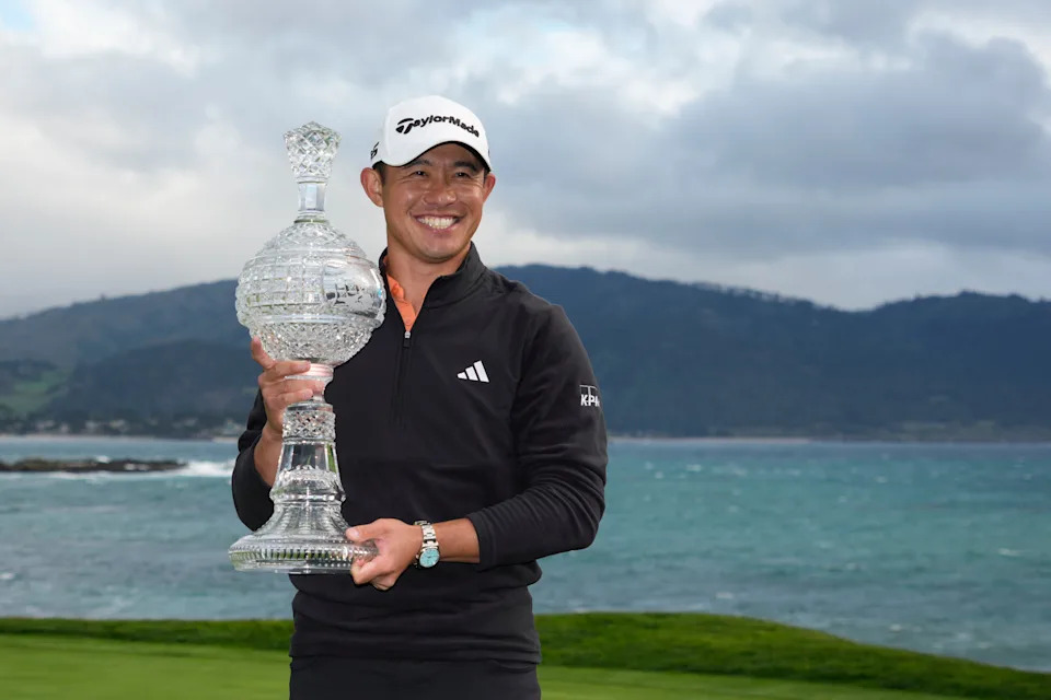 Collin Morikawa poses with the trophy during the final round of the AT&T Pebble Beach Pro-Am golf tournament at Pebble Beach Golf Links.