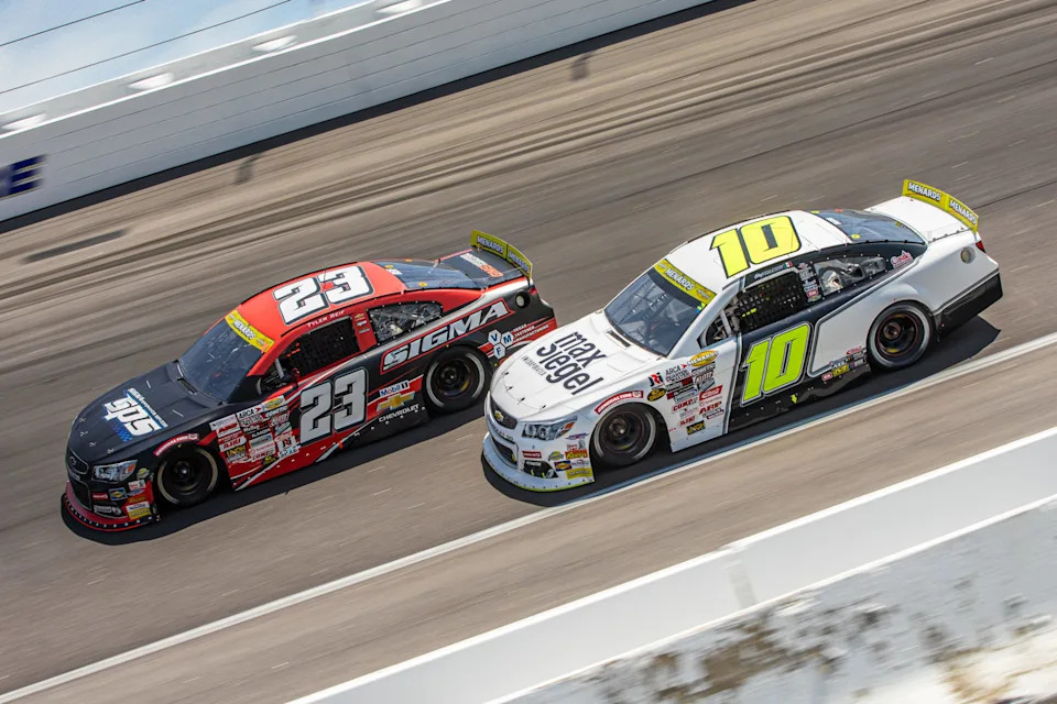 Eloy Falcon Lopez, driver of the No. 10 Max Siegel Inc. Chevrolet, and Tyler Reif, driver of the No. 23 SPS/Vegas Fastener Manufacturing Chevrolet, during the Rockingham ARCA 125 for the ARCA Menards Series at Rockingham Speedway on April 19, 2025 in Rockingham, North Carolina. (Ted Malinowski/NASCAR)